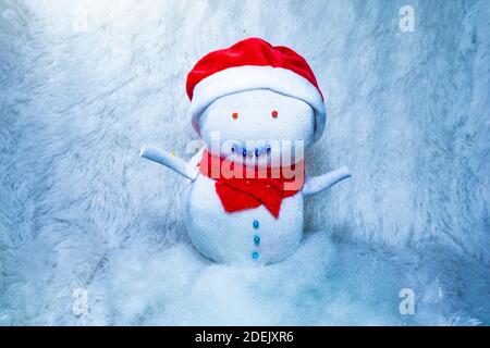 Snowman doll made from sock to celebrate Christmas. Fun activity with kids. Recycling old sock. Stock Photo