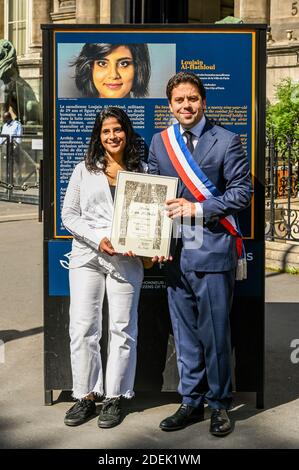 L-R : Lina Al Hathloul with honorary citizenship for her sister, jailed Saudi activist Loujain Al Hathloul and Paris Mayor Deputy Patrick Klugman pose next to a portrait of the jailed activist, near Hotel de Ville or City Hall, in Paris, France on June 21, 2019. Photo by Balkis Press/ABACAPRESS.COM Stock Photo