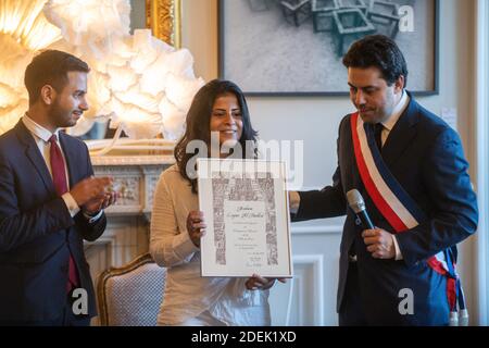 L-R : Omar Didi (MAG), Lina Al Hathloul receives honorary citizenship for her sister, jailed Saudi activist Loujain Al Hathloul from Paris Mayor Deputy Patrick Klugman at Hotel de Ville or City Hall, in Paris, France on June 21, 2019. Photo by Balkis Press/ABACAPRESS.COM Stock Photo