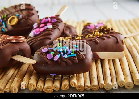 Pops cake in the form of chocolate ice cream with decoration Stock Photo