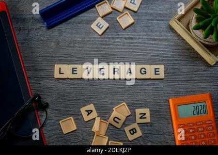Alphabets spelling flat lays on wooden background layouts Stock Photo