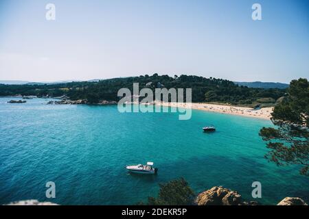 Seascape of a sand beach with some bathers on a sunny day Stock Photo