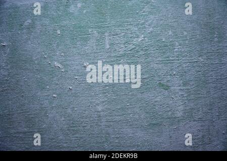 An old greyish green painted dirty wall Stock Photo