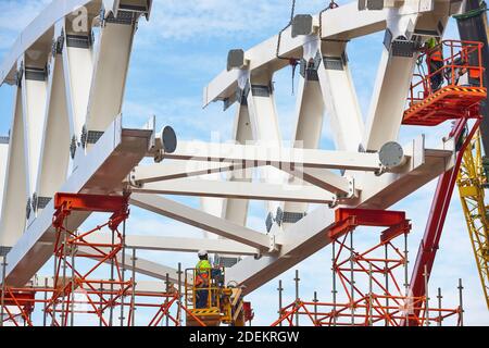 Workers on a construction site. Engineering and architectural infrastructure. Workplace Stock Photo
