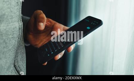 A man texting on a cellphone Stock Photo