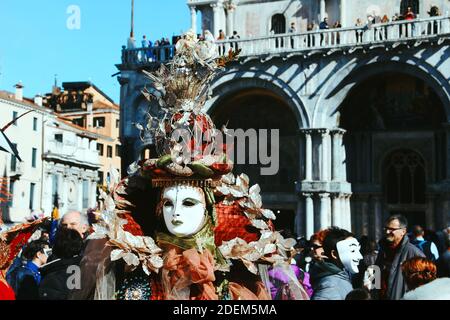 ITALY, VENICE - February 28 2017: Venice Carnival. typical mask in the square among the crowd Stock Photo