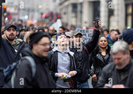 Anti-lockdown protest, London, 28 November 2020. Protesters marching. Stock Photo