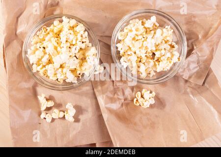 crispy golden ready to eat popcorn in a glass bowl. close up shot. Stock Photo