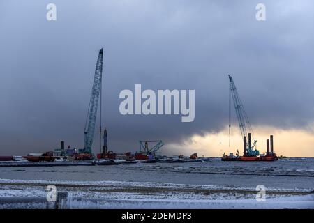 Construction Marine offshore works. Dam building, crane, barge, dredger. Breakwater construction. Stock Photo