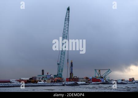 Construction Marine offshore works. Dam building, crane, barge, dredger. Breakwater construction. Stock Photo