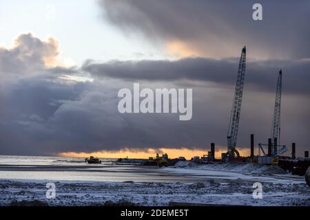 Construction Marine offshore works. Dam building, crane, barge, dredger. Breakwater construction. Stock Photo