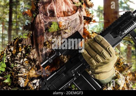 Camouflaged Hunter In Jungle Like Area With Sniper Rifle , He Must Blend  Into Surrounding To Not Be Detected Stock Photo, Picture and Royalty Free  Image. Image 67250301.