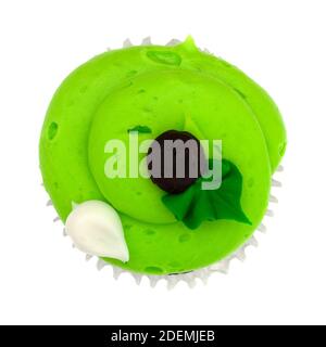 Top view of a brightly frosted decorated green cupcake isolated on a white background. Stock Photo