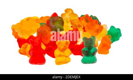 Side view of a pile of colorful gummi bear sugar candies isolated on a white background. Stock Photo