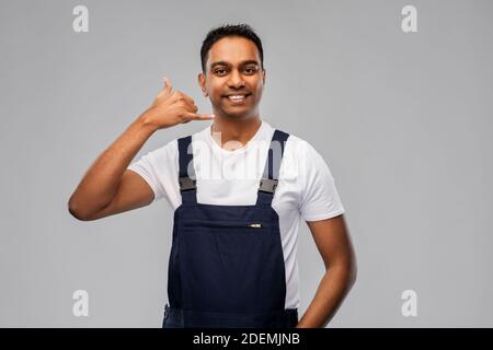 happy worker or builder making phone call gesture Stock Photo