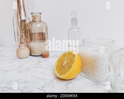 Ingredients for eco-friendly homemade cleaning products and laundry detergent such as essential oil, lemon, vinegar and soda crystals Stock Photo