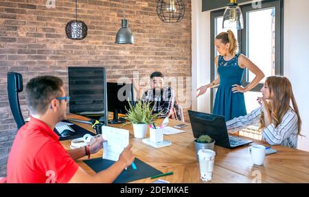 Female boss scolding an employee in the office Stock Photo