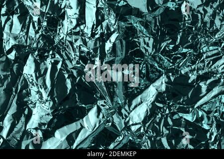 Abstract pattern of metal. Crumpled metallic paper. Tidewater green color Stock Photo