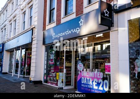 London UK, December 01 2020, Superdrug High Street Beauty and Pharmacy Shop Front Sign And Logo With No People Stock Photo