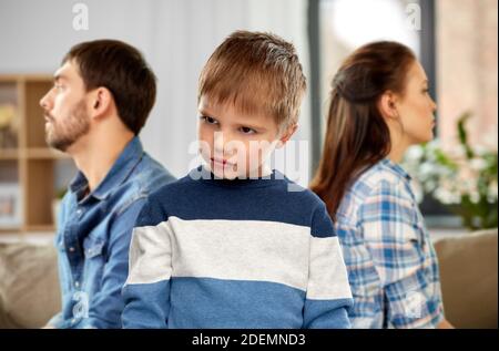 sad little boy with unhappy parents at home Stock Photo