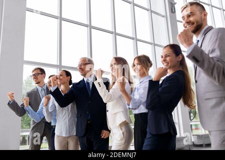 happy business team celebrating success at office Stock Photo