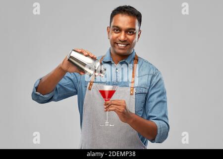 indian barman with glass of cocktail and shaker Stock Photo