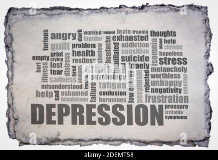 depression word cloud on a gray toned handmade paper, wellbeing and mental health concept Stock Photo