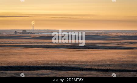 sunrise over prairie and foothills of northern Colorado near Fort Collins with a distant power plant Stock Photo