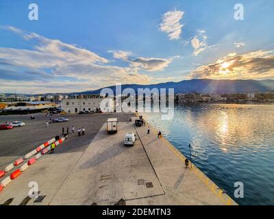 Beautiful scenery from the coastal city of Volos, Greece at sunrise. View from the departing morning ferry Stock Photo