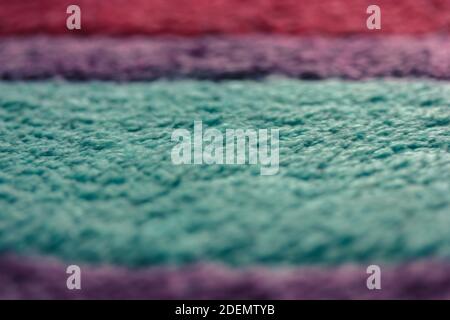 Multicolored striped carpet with long pile close-up. Stock Photo