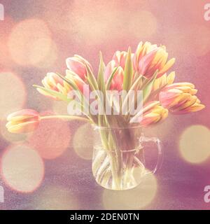 Red yellow tulips in glass vases Stock Photo