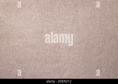 Beige natural cotton knitted fabric background or texture Stock Photo
