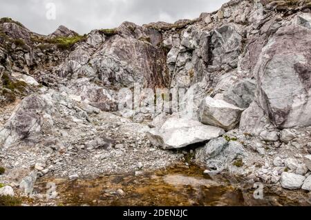 Blocks of Anorthosite at a small quarry near Lingerbay on South Harris in the Outer Hebrides. Stock Photo