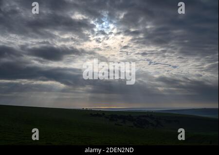 A high contrast view to the English Channel and Rampion offshore wind farm from South Downs, West Sussex, UK. Stock Photo