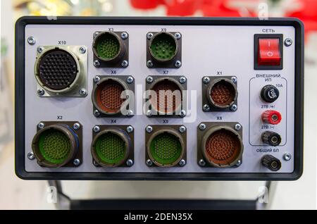 Modern electronic device for relay protection testing and commissioning closeup. Power cable connections. Stock Photo