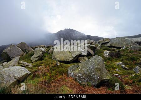 Shown here is a boulder field near Lake Ogwen in Snowdonia with Tryfan mountain in the background. Stock Photo