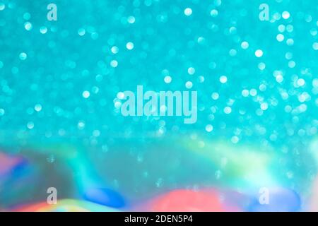 Abstract mixed holographic blue ai aqua blurred glitter shiny background. Liquid neon rainbow foil unicorn style. Bright sparkling bokeh style. Festiv Stock Photo