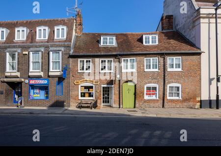 Roadside view of buildings in East Street, Blandford Forum, a traditional market town in Dorset, SW England, with typical Georgian architecture Stock Photo