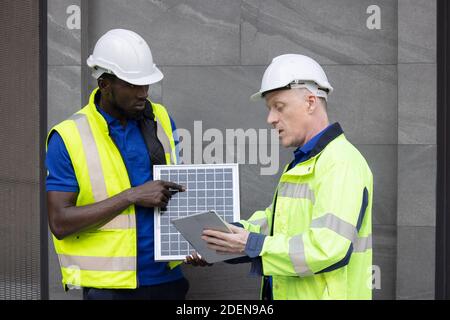 Team Meeting of Renewable Energy Engineers Working on an Innovative More Efficient Solar Panel Battery Concept, Solving Problems Stock Photo