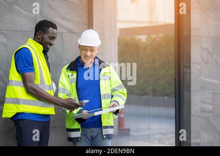Team Meeting of Renewable Energy Engineers Working on an Innovative More Efficient Solar Panel Battery Concept, Solving Problems Stock Photo