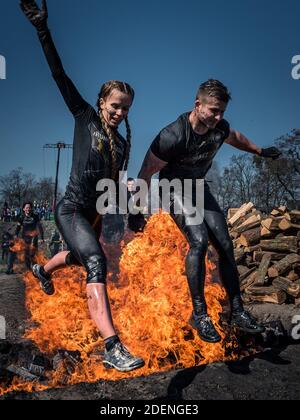 WROCLAW, POLAND - APRIL 7; 2018: Extreme running with obstacle RUNMAGEDDON. In the picture a runner on the Recruit route. Stock Photo