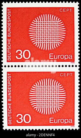 MOSCOW, RUSSIA - JUNE 28, 2020: Two postage stamps printed in Germany shows Flaming Sun, Europa (C.E.P.T.) serie, circa 1970 Stock Photo