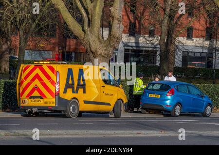 An aa automobile association recovery breakdown van assistant a motorist at the roadside Stock Photo