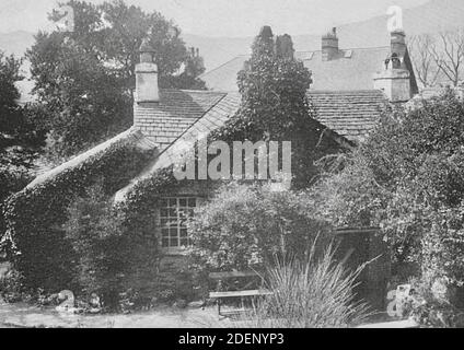 Dove Cottage is a house on the edge of Grasmere in the Lake District of England. It is best known as the home of the poet William Wordsworth Stock Photo