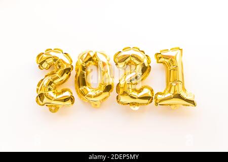 Foil balloons in the form of numbers 2021. New year celebration. Gold air balloons. Holiday party decoration. top view. Stock Photo