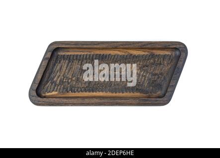 The dish is carved from natural solid oak, brown color on a white background Stock Photo