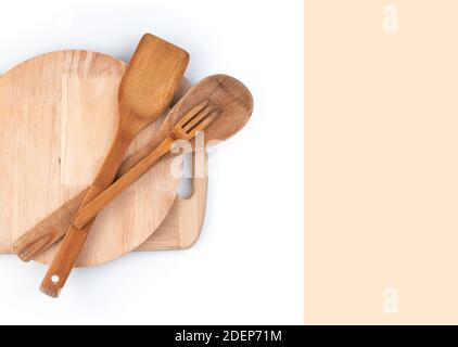 Cutting boards and wooden spatulas on a white background with space to copy. Stock Photo