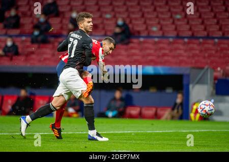 Madrid, Spain. 1st December 2020; Madrid, Spain, UEFA Champions League football group stages, Atletico Madrid versus Bayern Munich; Lucas Hernandez FC Bayern Muenchen and Angel Correa Atletico Madrid challenge for the ball Credit: Action Plus Sports Images/Alamy Live News Stock Photo