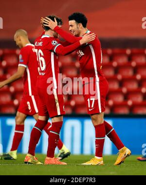 Liverpool's Curtis Jones (no.17) celebrates scoring his side's first goal of the game with Neco Williams during the UEFA Champions League Group D match at Anfield, Liverpool. Stock Photo