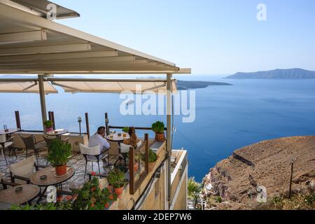 Santorini Greece, September 17, 2020: Greek seafront restaurant in Fira on Santorini Island. Cyclades, Greece Stock Photo